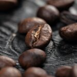 Coffee beans on wood background