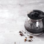 Coffee maker pot filling with coffee beans