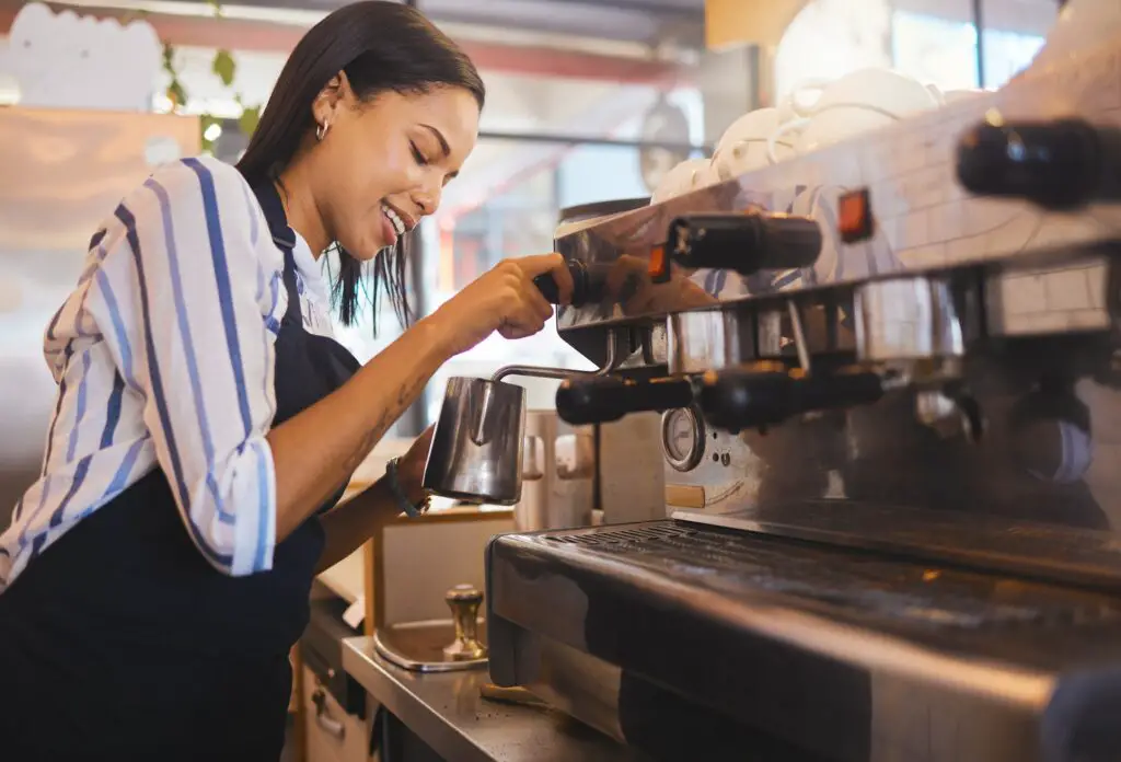 Coffee shop etiquette, cafe and restaurant with a barista working as a startup entrepreneur and small business. 