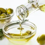 Olive oil and olives in bowls